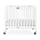 Foundations Boutique Compact Folding Wood Crib with 3" Foam Mattress and Oversized Casters - Matte White