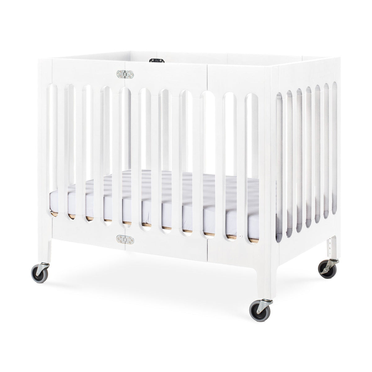 Foundations Boutique Compact Folding Wood Crib with 3 Foam Mattress and Oversized Casters Matte White