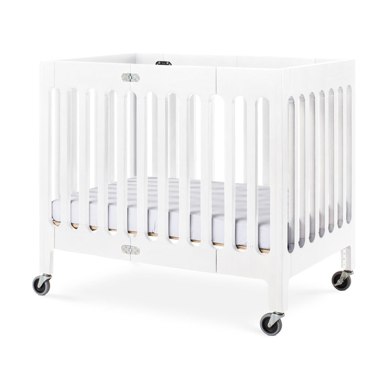 Foundations Boutique Compact Folding Wood Crib with 3" Foam Mattress and Oversized Casters - Matte White
