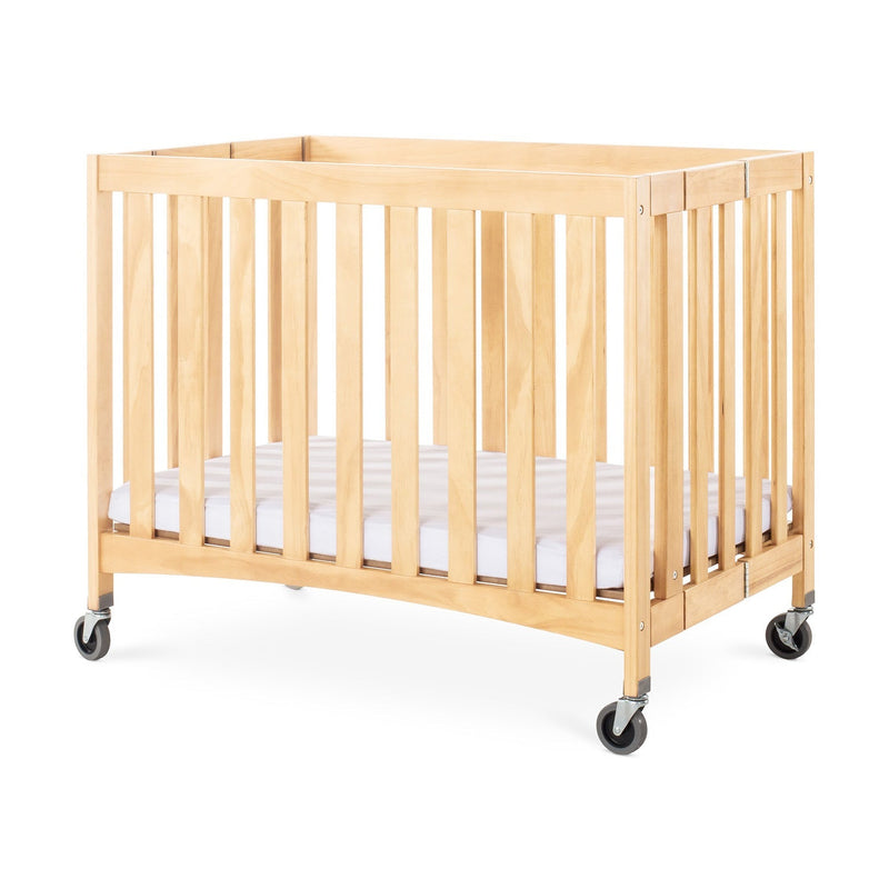 Foundations Travel Sleeper Compact Folding Wood Crib with 2" Foam Mattress and Oversized Casters - Natural
